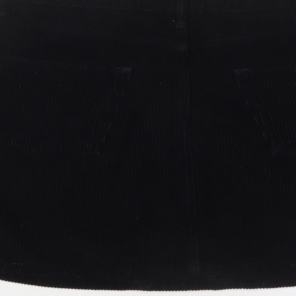 Brand and care label for BDG women’s black cotton a-line skirt, size M, zip