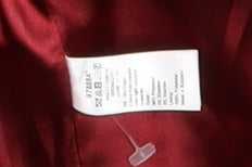 Brand and care label for Monsoon girls’ red hooded wool-blend coat, size 10