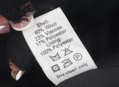 Brand and care label for Mackays Black Hooded Jacket, size 12