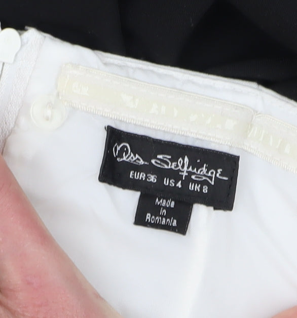 Close-up detail of Miss Selfridge Women’s White Black Bow Jumpsuit, size UK 8