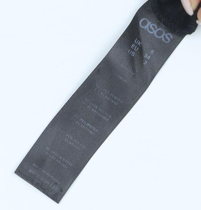 Close-up detail of ASOS Women's Black Lace Up Pencil Skirt, size 6, Elegant Style