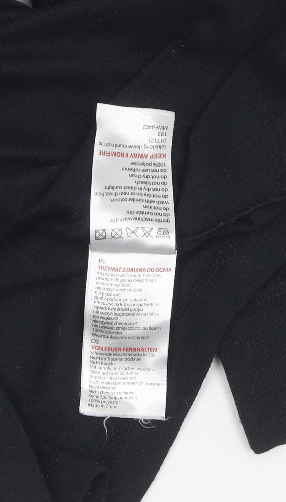 Brand and care label for Mountain Warehouse unisex black long sleeve activewear top