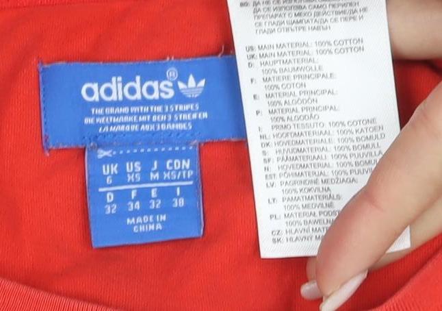 Close-up detail of Adidas Women's Red T-Shirt, size 6, Sporty Casual Style