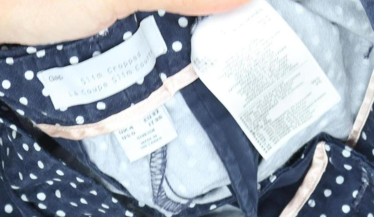 Close-up detail of Guess Women's Blue Polka Dot Cropped Trousers, size S