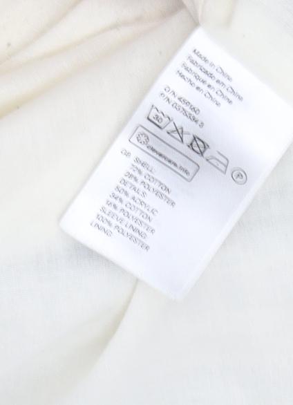 Brand and care label for H&M Ivory Mid-Length Women's Coat, size 8, Casual Elegance