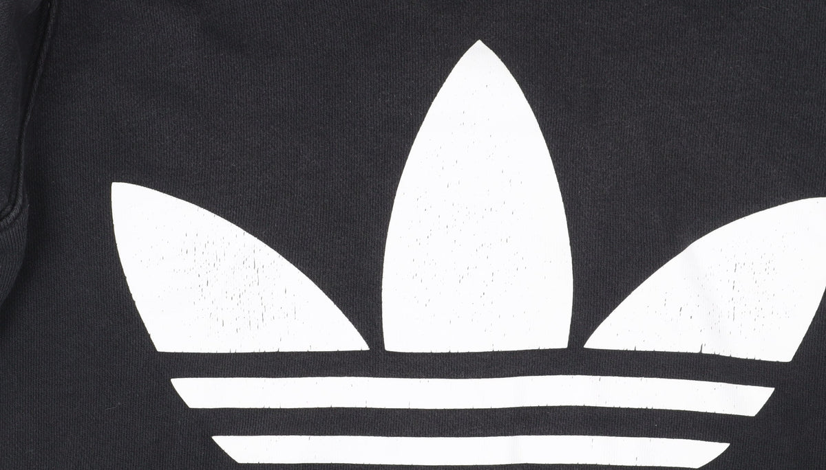 Brand and care label for Adidas unisex black pullover hoodie, size 12, sporty logo