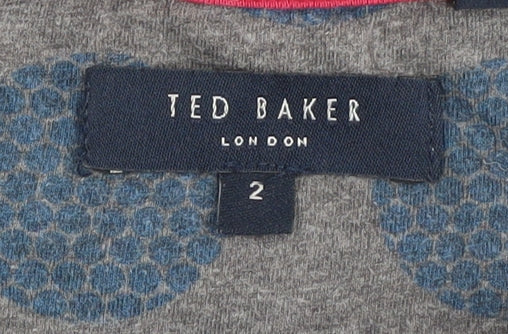 Close-up detail of Ted Baker unisex blue polka dot t-shirt, size S