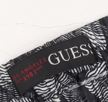 Brand and care label for Guess Women's Multicoloured XS Floral Joggers