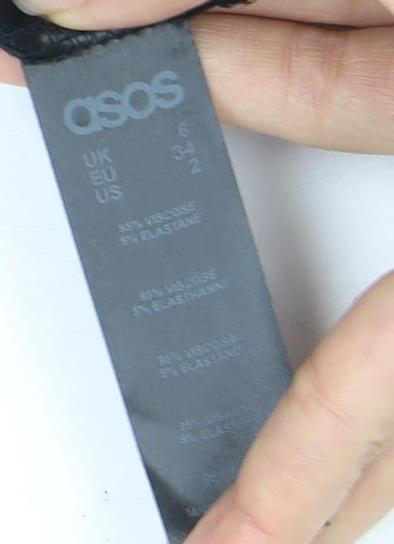 Close-up detail of Asos Women's Black Jersey Strappy Dress, size 6