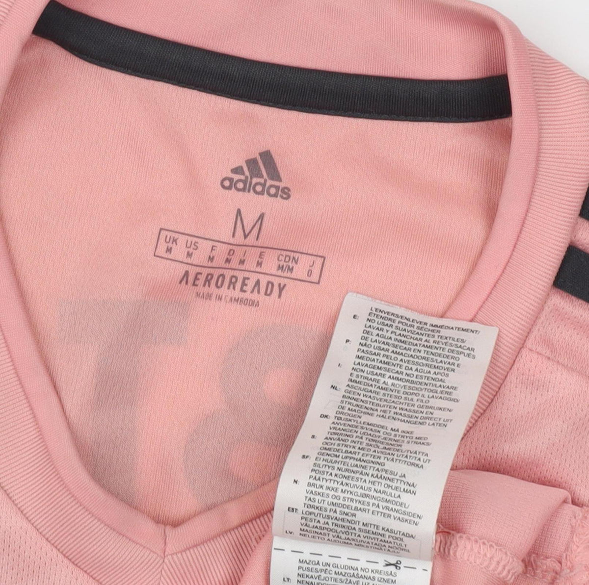 Close-up detail of Adidas unisex pink football t-shirt m moisture wicking