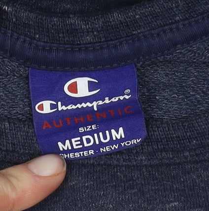 Close-up detail of Champion unisex blue pullover sweatshirt m