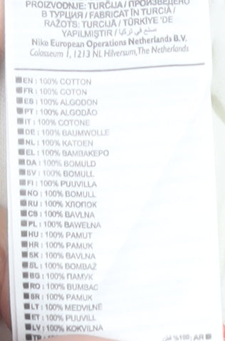 Brand and care label for Nike unisex white athletic t-shirt, size S, casual sportswear