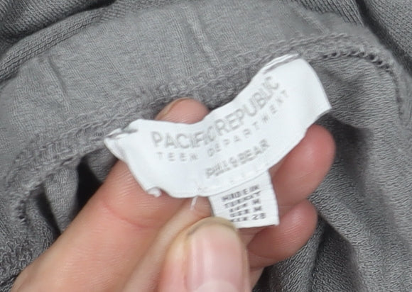 Brand and care label for PACIFIC REPUBLIC Teens Grey Skirt, size M, Excellent Condition