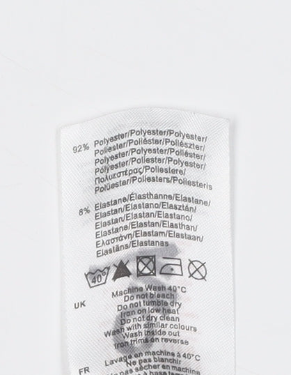 Brand and care label for Sondico boys’ black compression leggings 146 athletic