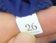 Brand and care label for Nike boys’ blue athletic football shorts, size 3