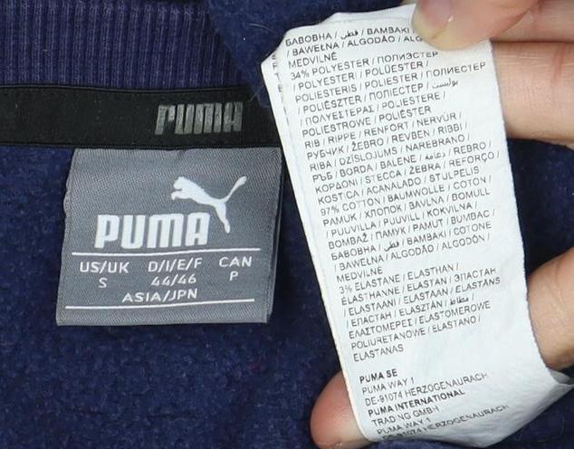 Close-up detail of Puma unisex adults blue sweatshirt, size S, crew neck