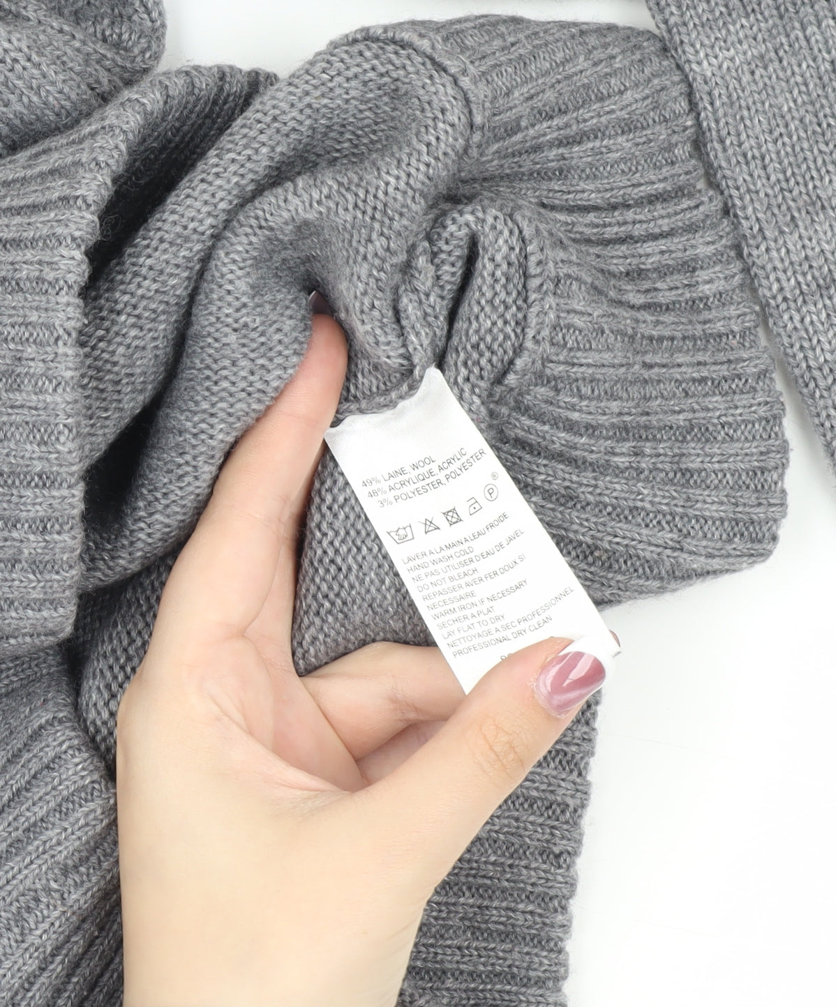 Brand and care label for MK University unisex grey v-neck jumper m