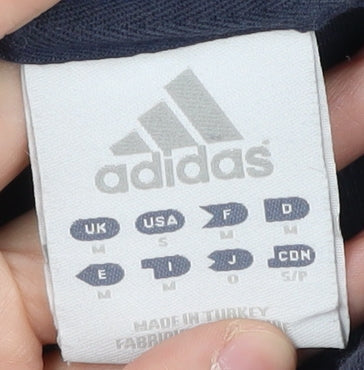 Brand and care label for Adidas men’s blue medium polo shirt sports casual