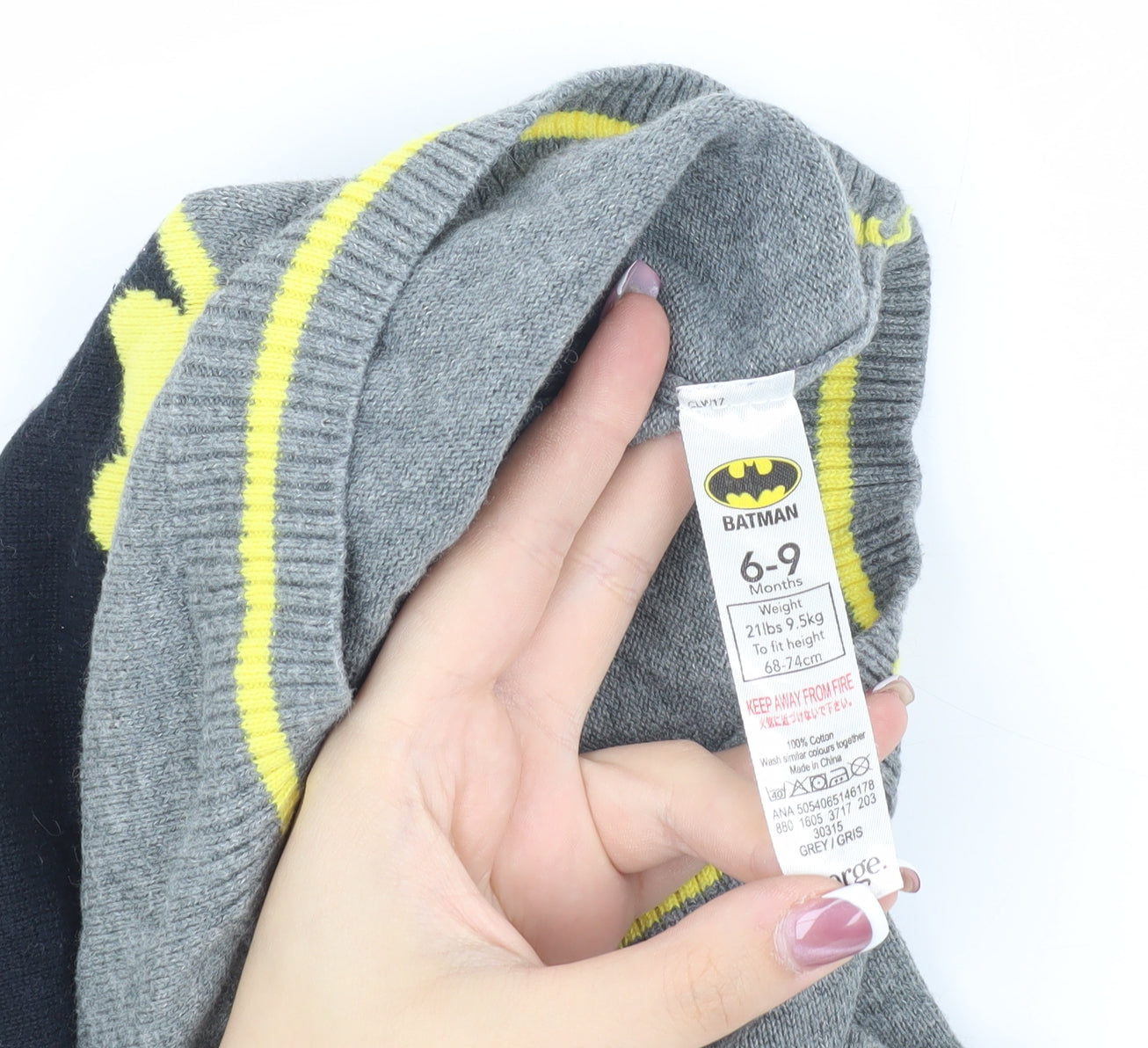 Close-up detail of Batman boys’ grey 6-9m superhero jumper with button closure