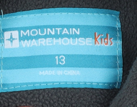 Brand and care label for Mountain Warehouse boys’ black fleece jacket 13 years