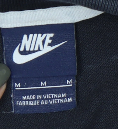 Close-up detail of Nike unisex black m polo shirt casual style