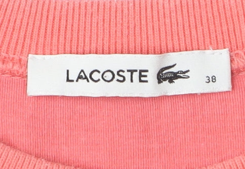 Brand and care label for Lacoste Women's Pink Sleeveless Sweatshirt, size 10