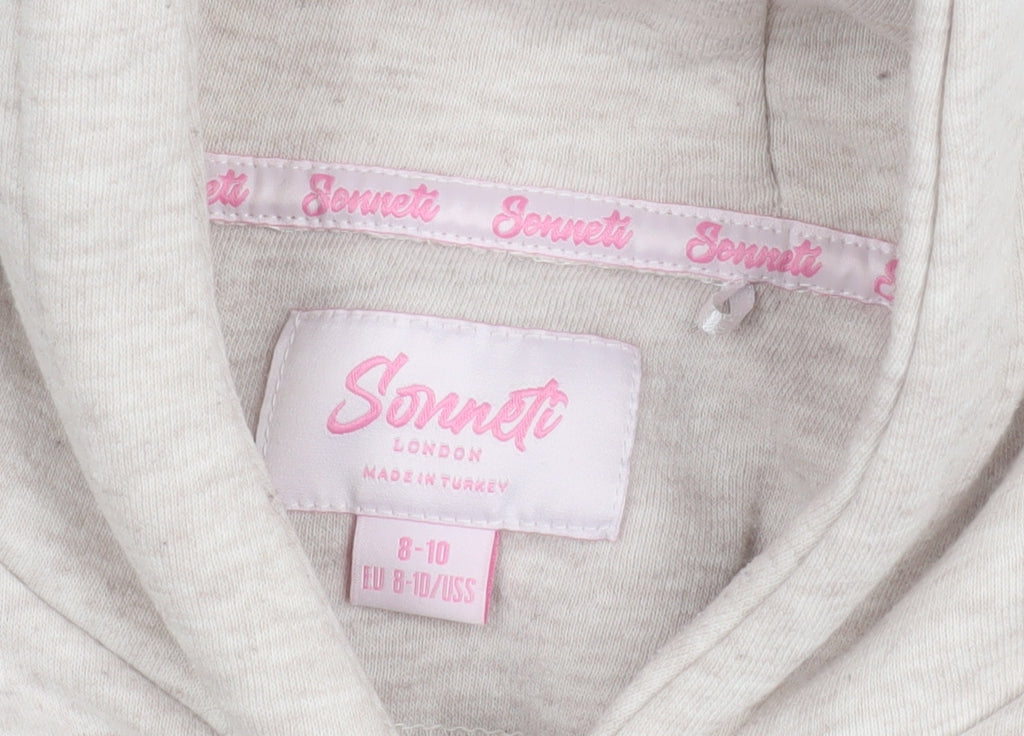 Close-up detail of Sonneti girls’ beige hoodie - 8-10, pullover, graphic print