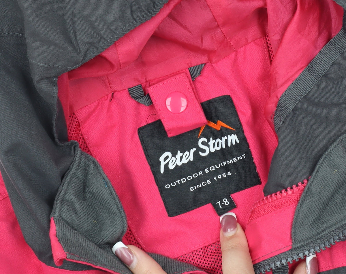 Close-up detail of Peter Storm girls’ black hibiscus waterproof jacket, size 7-8