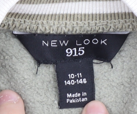 Close-up detail of New Look girls’ varsity jacket green 10-11 years