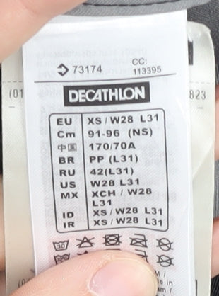 Brand and care label for Decathlon unisex black xs track pants for hiking