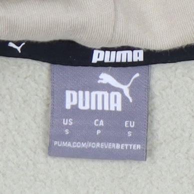 Close-up detail of Puma unisex beige s hoodie, logo accent