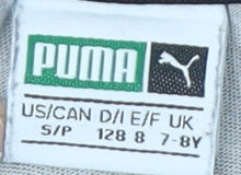 Brand and care label for Puma Teens Black Floral T-Shirt, size 8, Casual Crew Neck