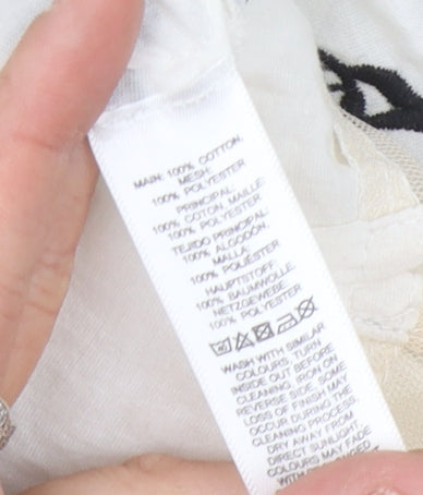 Brand and care label for ASOS Women's Ivory Floral Slip Dress, size 12