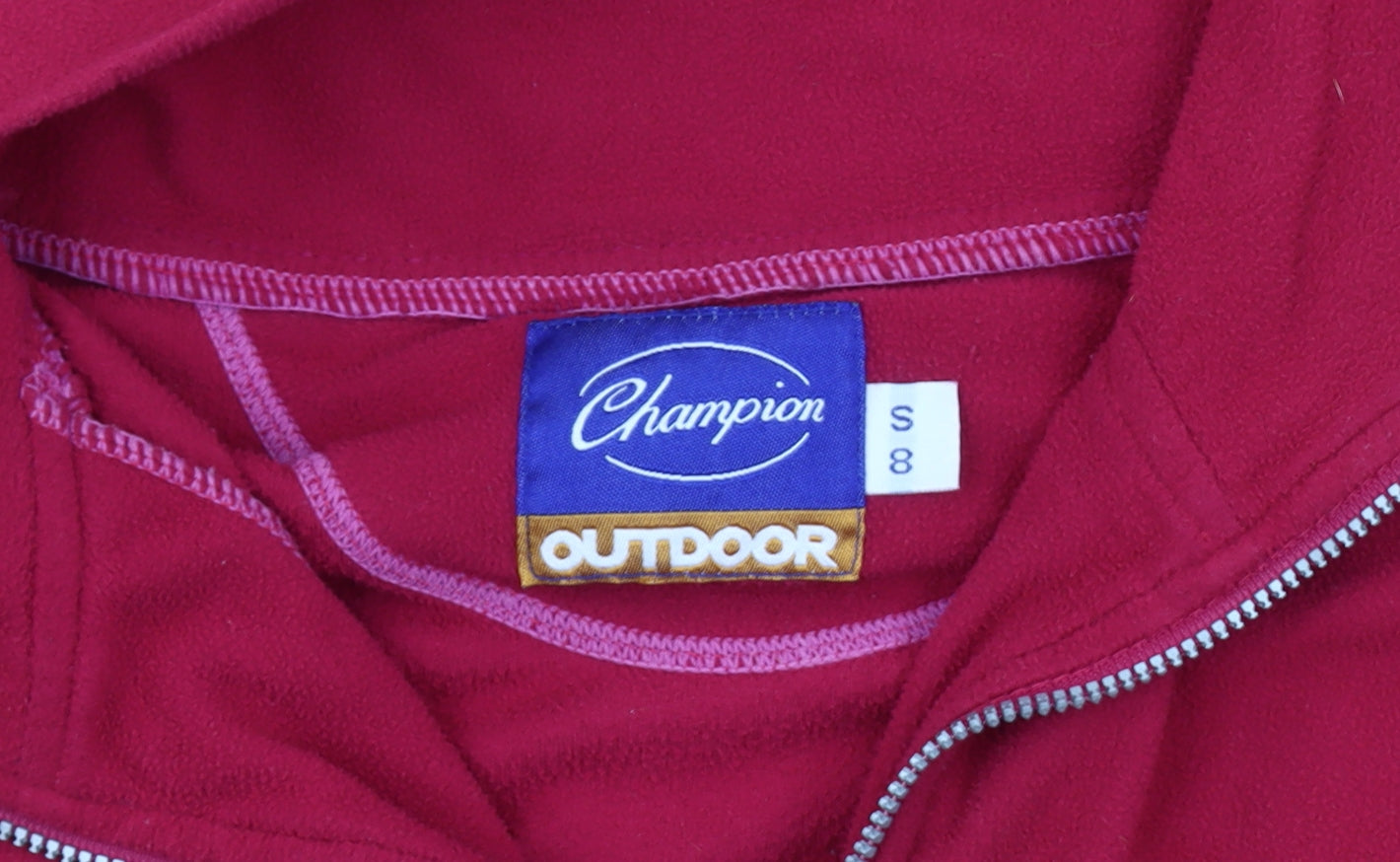 Close-up detail of Champion unisex red fleece sweatshirt, size S, 1/2 zip