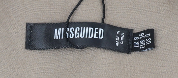 Brand and care label for Missguided Women's Beige Blazer, size 8, with Lining