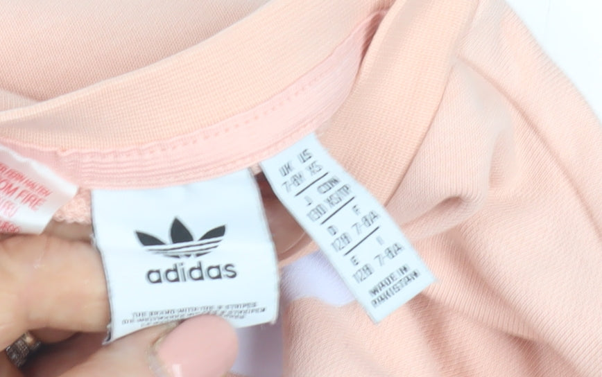 Close-up detail of Adidas girls’ pink pullover sweatshirt, 7 years, logo accent