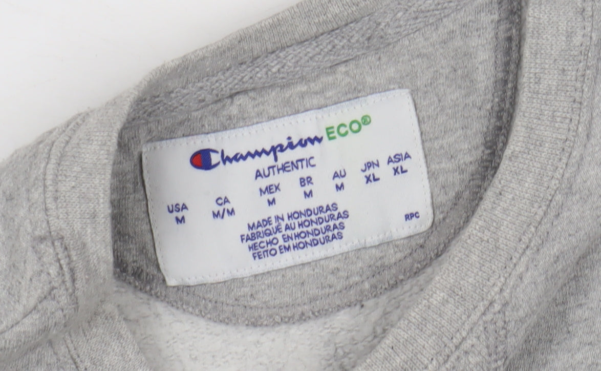 Close-up detail of Champion Grey unisex sweatshirt m eco-friendly logo