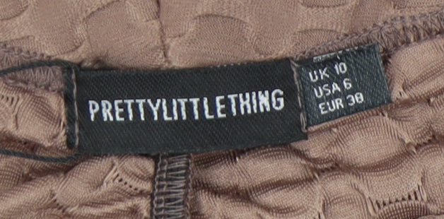 Brand and care label for PRETTYLITTLETHING Women's Brown Geometric Leggings, size 10