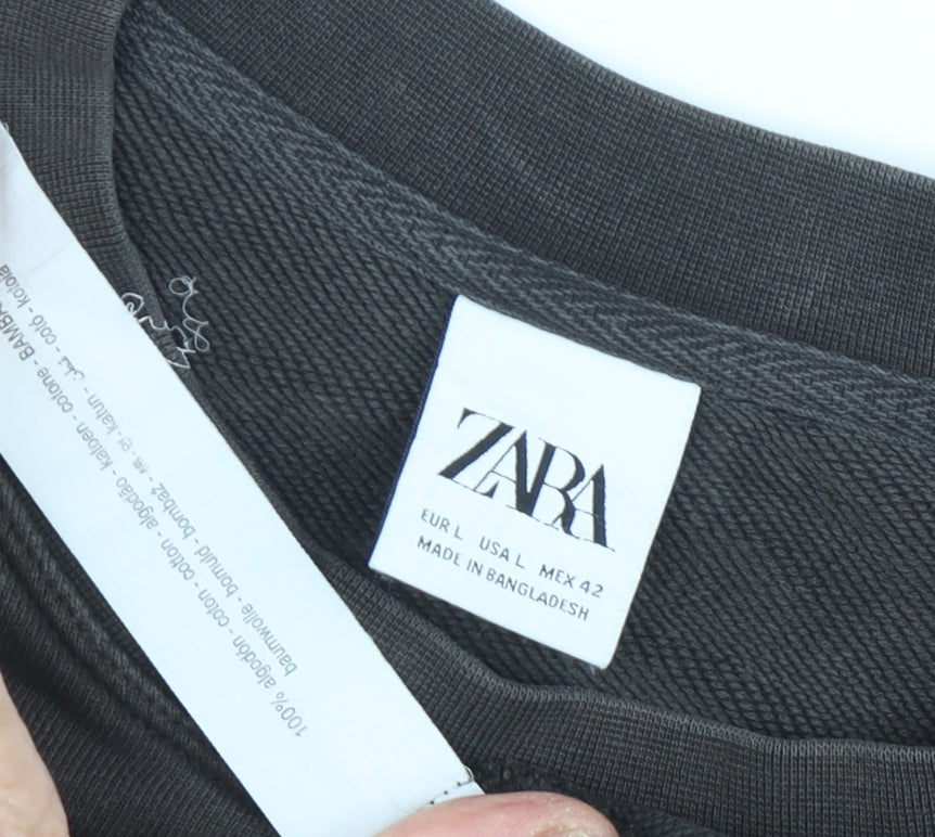 Brand and care label for Zara unisex black crew neck sweatshirt, size 14