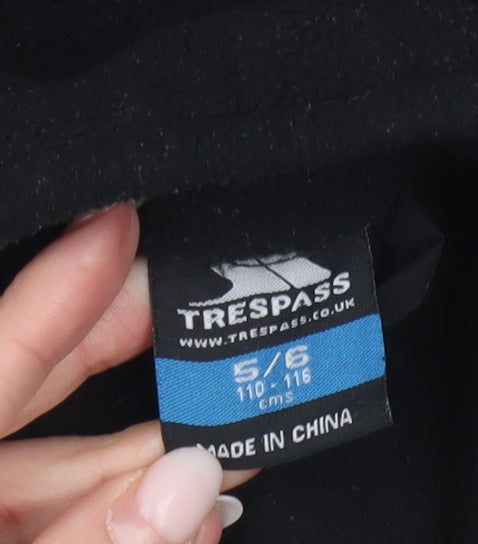 Brand and care label for Trespass boys’ black fleece full zip basic jacket 5-6 years