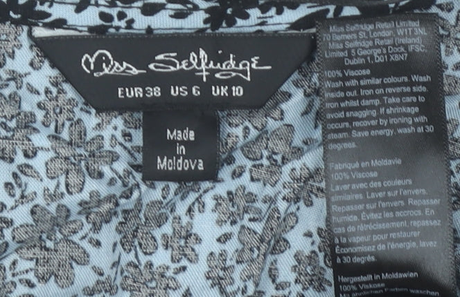 Brand and care label for Miss Selfridge Women’s Blue Floral Viscose Wrap Blouse UK 10