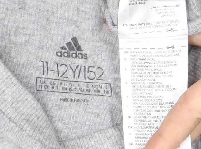 Brand and care label for Adidas boys’ grey 11-12 years logo t-shirt short sleeve crew neck