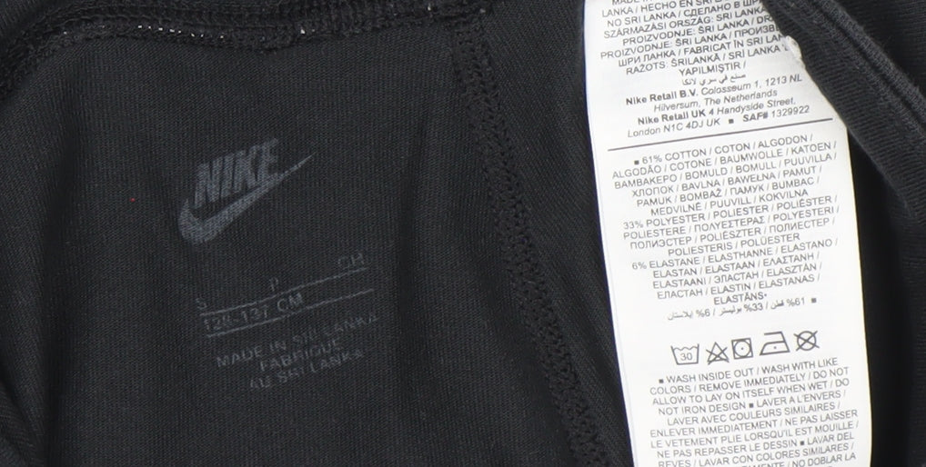 Brand and care label for Nike girls’ black ankle leggings s slim fit activewear stretch trousers