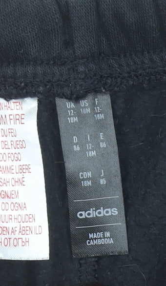 Brand and care label for Adidas unisex baby black track pants 12-18 months elastic waist activewear