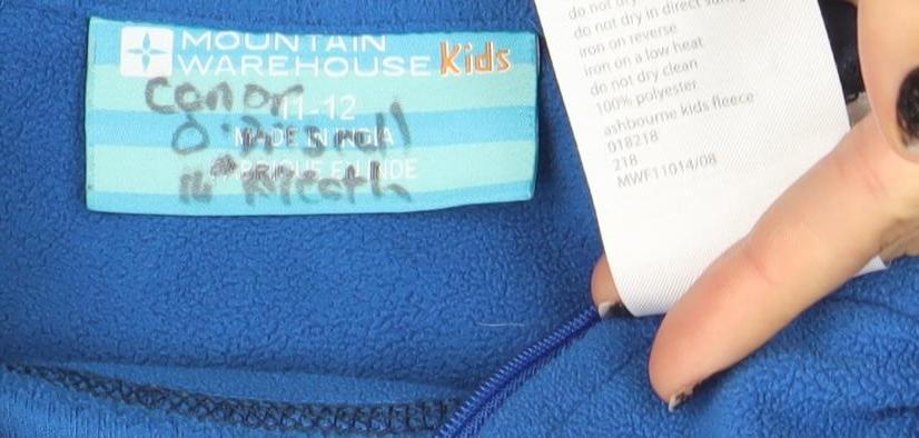 Brand and care label for Mountain Warehouse Kids Blue Fleece 1/2 Zip Pullover Hoodie 11-12 Years