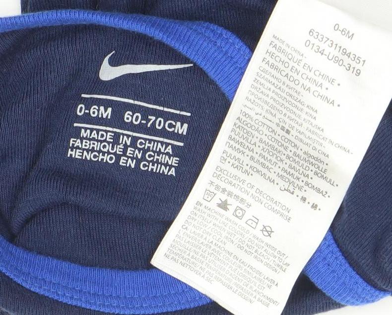 Brand and care label for Nike Blue Long Sleeve Baby Bodysuit 0-6 Months unisex sports babygrow
