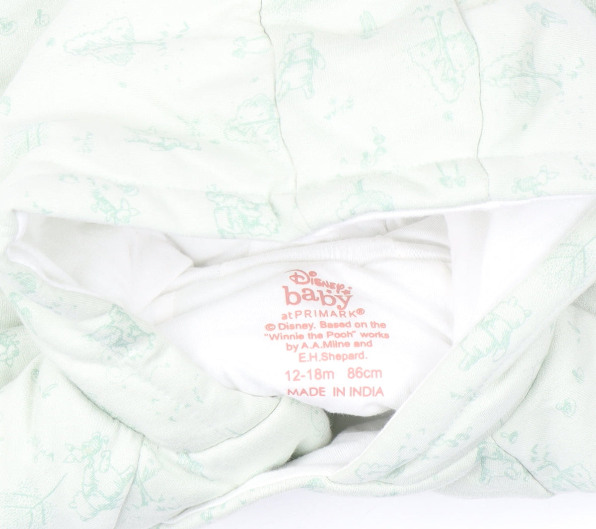 Brand and care label for Disney Baby at Primark Winnie the Pooh Green Hooded Puffer Coat 12-18 Months