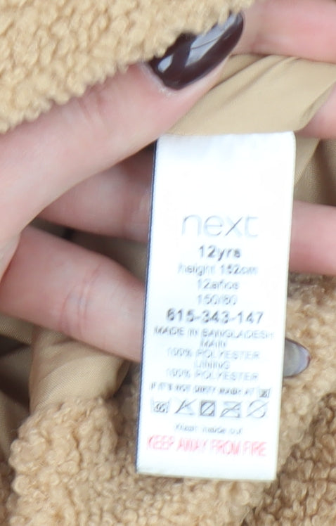 Brand and care label for Next girls’ beige teddy fleece single breasted coat 12 years