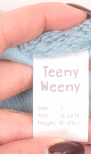 Brand and care label for Teeny Weeny unisex baby blue faux fur waistcoat 18-24 months lined soft vest