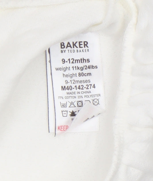 Brand and care label for Ted Baker girls’ ivory long sleeve tunic t-shirt 9-12 months cotton blend